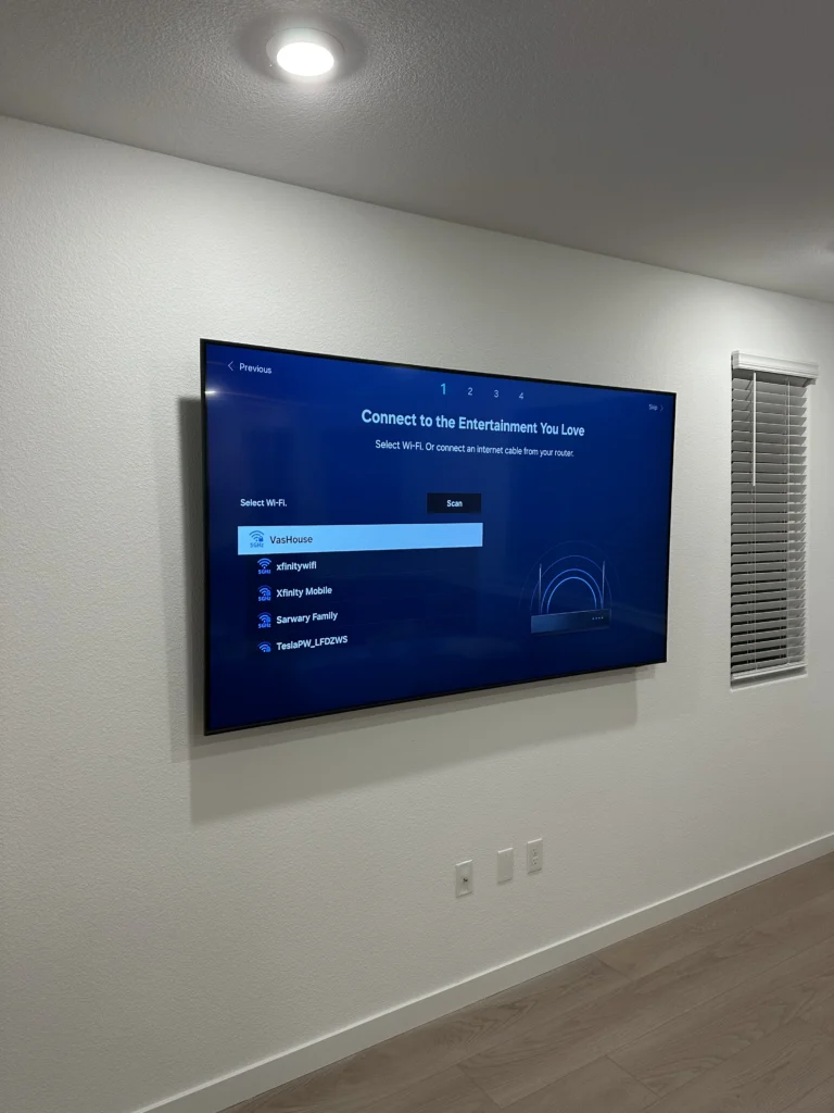 Large TV on drywall. No cables showing.