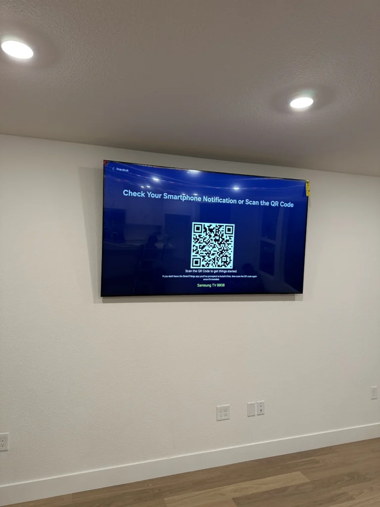 TV on a long living-room wall. No cables showing.