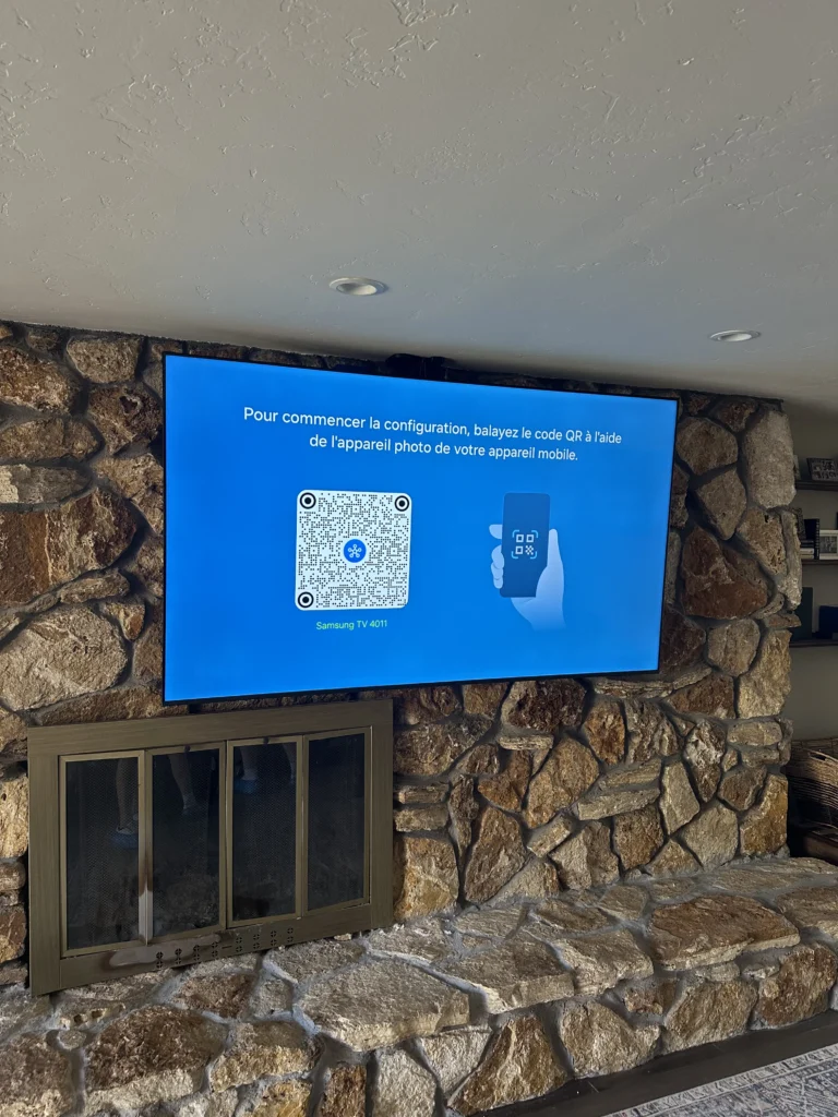 TV anchored into a river-rock fireplace wall.